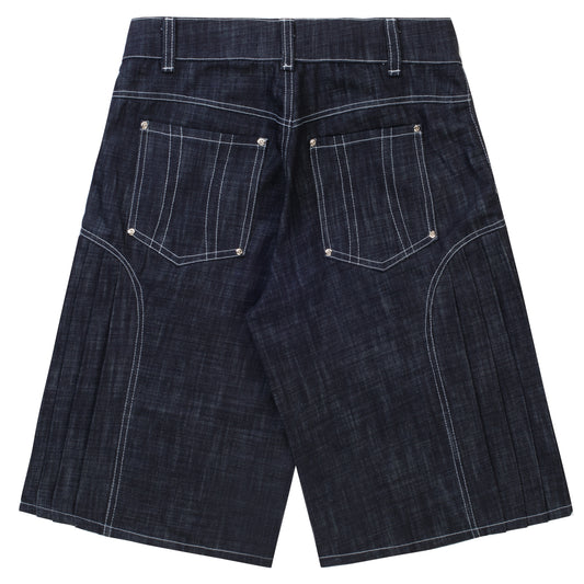 'Uniform' pleated raw denim jorts
