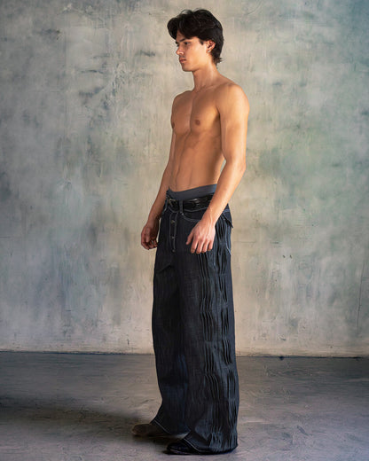 'distorted' wavy pleated raw denim pants