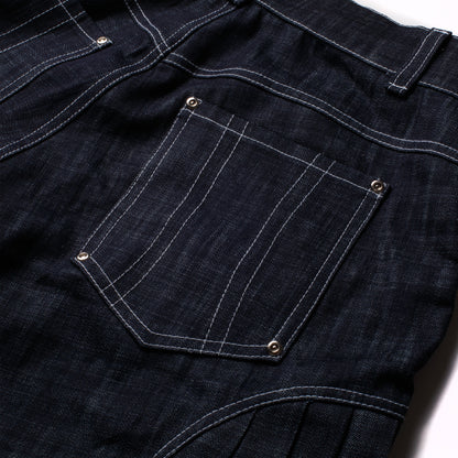 'Uniform' pleated raw denim jorts